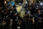 Policemen use pepper spray on demonstrators during a scuffle at a protest near the Charlotte Convention Center, the site of the Republican National Convention, in Charlotte, North Carolina, U.S. August 23, 2020. REUTERS/Leah Millis     TPX IMAGES OF THE DAY