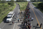 Central American migrants walk along the highway near of Ciudad Hidalgo after crossing to Mexico from Guatemala with the hope of reaching the U.S. eventually.