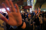 Protesters sing Glory to Hong Kong and hold up their hands to signify the {quote}five demands{quote} outside of Polytechnic University (PolyU) while police keep it under siege in Hong Kong, China, November 25, 2019.