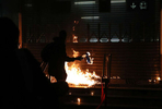 A protester throws a Molotov cocktail at an MTR station in Hung Hom after a day of protests in Hong Kong, China December 1, 2019.