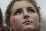 Annika Jernstedt, 13, listens to speakers during a rally in Civic Center Plaza before the Women's March Jan. 21, 2017 in San Francisco, Calif. Thousands gathered in San Francisco to march in solidarity with the Women's March on Washington D.C. to protest the presidency of Donald J. Trump and to rally for the rights of all races, classes and gender identities.