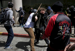 Pro-Trump and anti-fascist protesters brawl in the street on Milvia and Center streets after a rally called {quote}Patriot's Day Free Speech Rally{quote} in Martin Luther King Jr. Civic Center Park turned violent April 15, 2017 in Berkeley, Calif.
