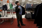 James Kaplan, 9, puts on a cool guy persona while trying on a new blazer during a shopping trip to Target for new clothes Feb. 17, 2017 in Berkeley, Calif. James vividly remembers the first time he went shopping with his mother in the boy's section of the store, it was an experience he had only dreamed about before he came out.