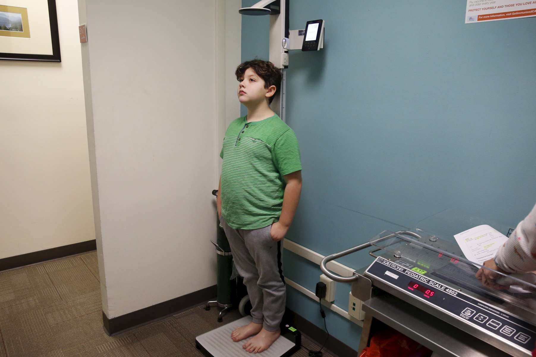 James Kaplan, 9, gets his height measured during an appointment with his pediatric doctor to check on his physical development Dec. 13, 2016 in Berkeley, Calif. Eventually,  James will be put on hormone blockers to stop the effects of puberty until he is a young teen. If he still insists on his current gender identity, he will then be put on cross-hormone therapy which will allow him to experience development that aligns with his gender identity. 