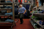 James Kaplan dances through the boy's section at Target Feb. 17, 2017 in Berkeley, Calif. while finding dress clothes with his mother and sibling.