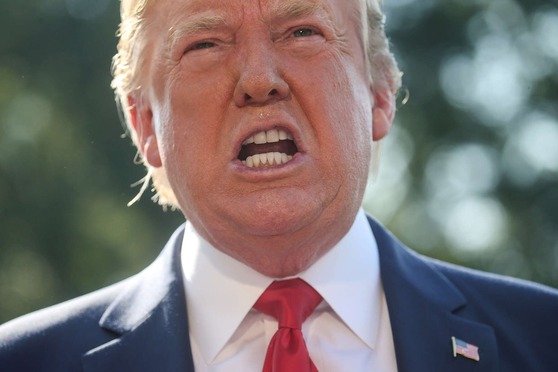 U.S. President Donald Trump talks to reporters as he departs for travel to Williamsburg, Virginia from the South Lawn of the White House in Washington, U.S., July 30, 2019. Trump doubled down on disparaging remarks he had made about Baltimore and Rep. Elijah E. Cummings (D-Md.), saying the people were {quote}living in hell{quote}. When asked later by a reporter why he was lashing out at Cummings, who is not the mayor of Baltimore but is the chairman of the House Oversight Committee, which is looking into Trump's finances, Trump said, {quote}now, he’s in charge of an Oversight Committee. All I’m saying is take your Oversight Committee and go to Baltimore.  You’ll learn a lot.{quote}  