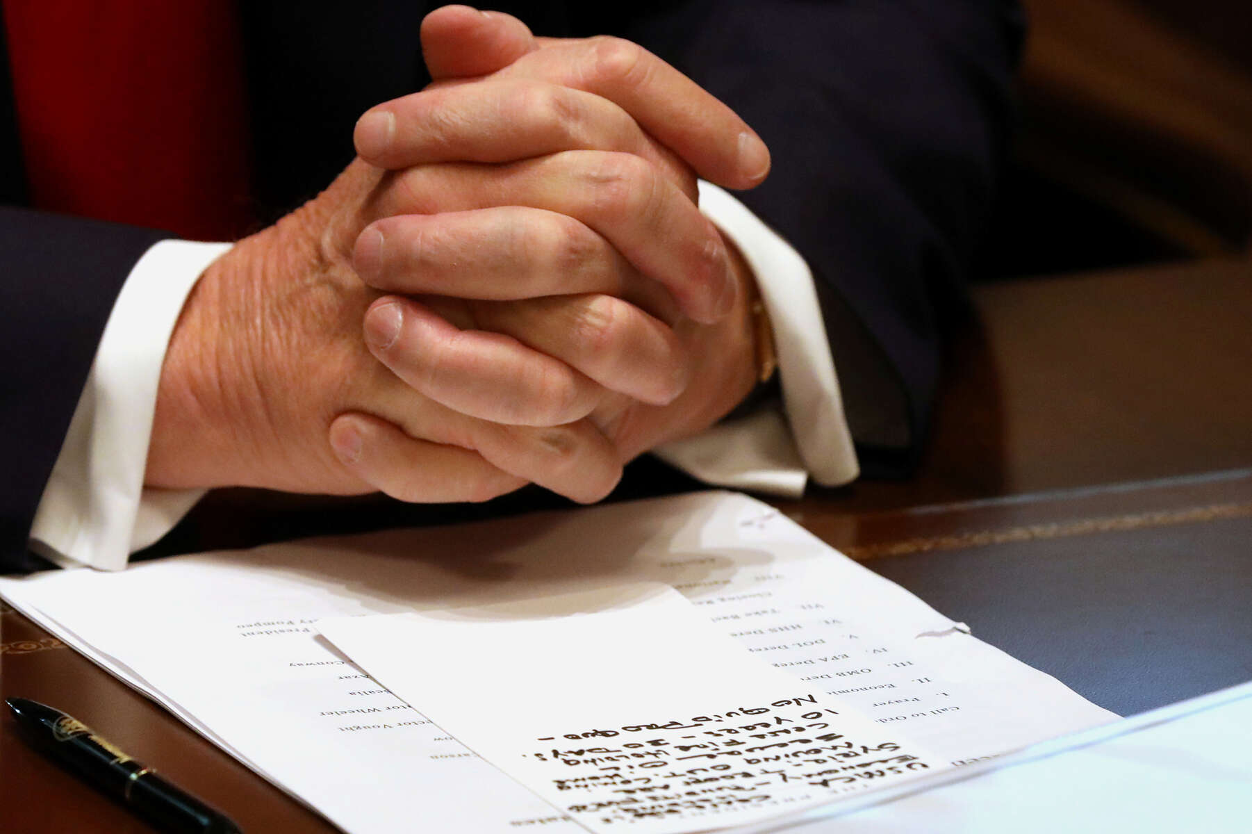Talking points are visible in front of U.S. President Donald Trump as he speaks during a cabinet meeting at the White House in Washington, U.S., October 21, 2019. Within the notes, {quote}No Quid Pro Quo{quote} is visible. REUTERS/Leah Millis