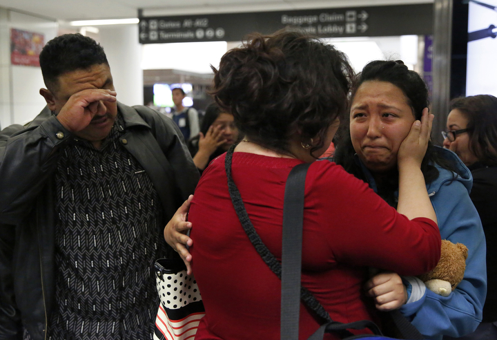 Maria Mendoza-Sanchez says her final words of good bye while holding her daughter Melin, 21, as her husband Eusebio tries to keep his composure as they leave for their self-deportation flight back to Mexico from San Francisco International Airport August 16, 2017 in San Francisco, Calif. 