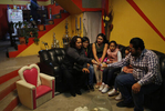 Maria Mendoza-Sanchez passes around photos of a property she owns next door while sitting with family members, from left, Elizabeth Villarreal,     Ariana Sanchez, Ambar Sanchez, 9, Jade Sanchez, 7, and Irvin Sanchez during a visit to check in on her property and take care of related paperwork Sept. 27, 2017 near Mexico City, Mexico.