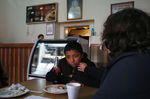 Maria Mendoza-Sanchez gently touches her son Jesus, 12, on the chin while talking to him about the food he didn't finish during a government tour given to the Chronicle of various sights around Hidalgo Sept. 29, 2017 in Mexico. Maria says that Jesus is a selective eater and had trouble adjusting to constant Mexican food.