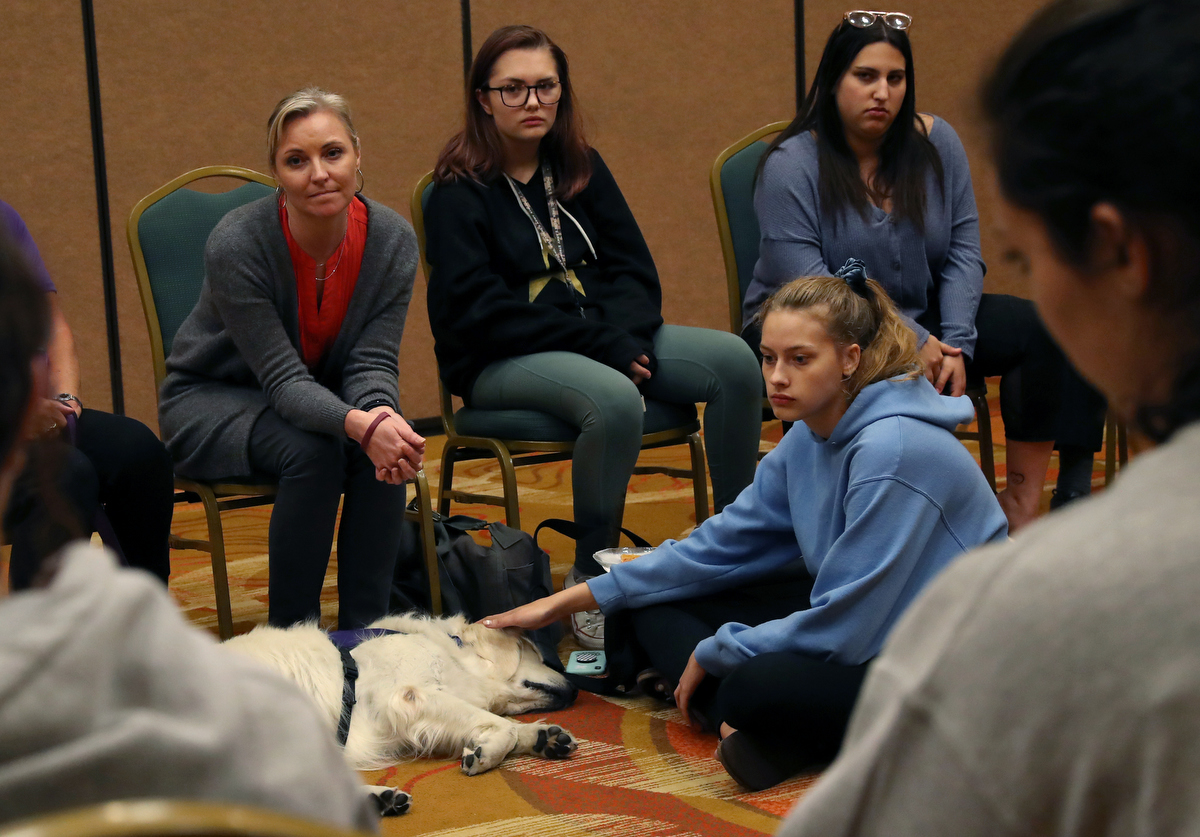 Heather Martin, left, who survived the shooting at Columbine high school nearly 20 years ago, leads a support session for students from Marjory Stoneman Douglas, from left of Martin, Ava Steil, 16, Hayley Siegel, 18, and Brianna Jesionowski, 16, during a Parkland MSD Community Peer Support Event April 2, 2019 in Coral Springs, Florida, US. 
