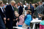 U.S. President Donald Trump greets children during the annual White House Easter Egg Roll on the South Lawn of the White House in Washington, April 2, 2018. REUTERS/Leah Millis