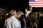 Democratic presidential candidate Sen. Elizabeth Warren kisses her husband Bruce Mann after finishing her speech during Jim Clyburn's World Famous Fish Fry in Columbia, South Carolina, U.S., June 21, 2019. 