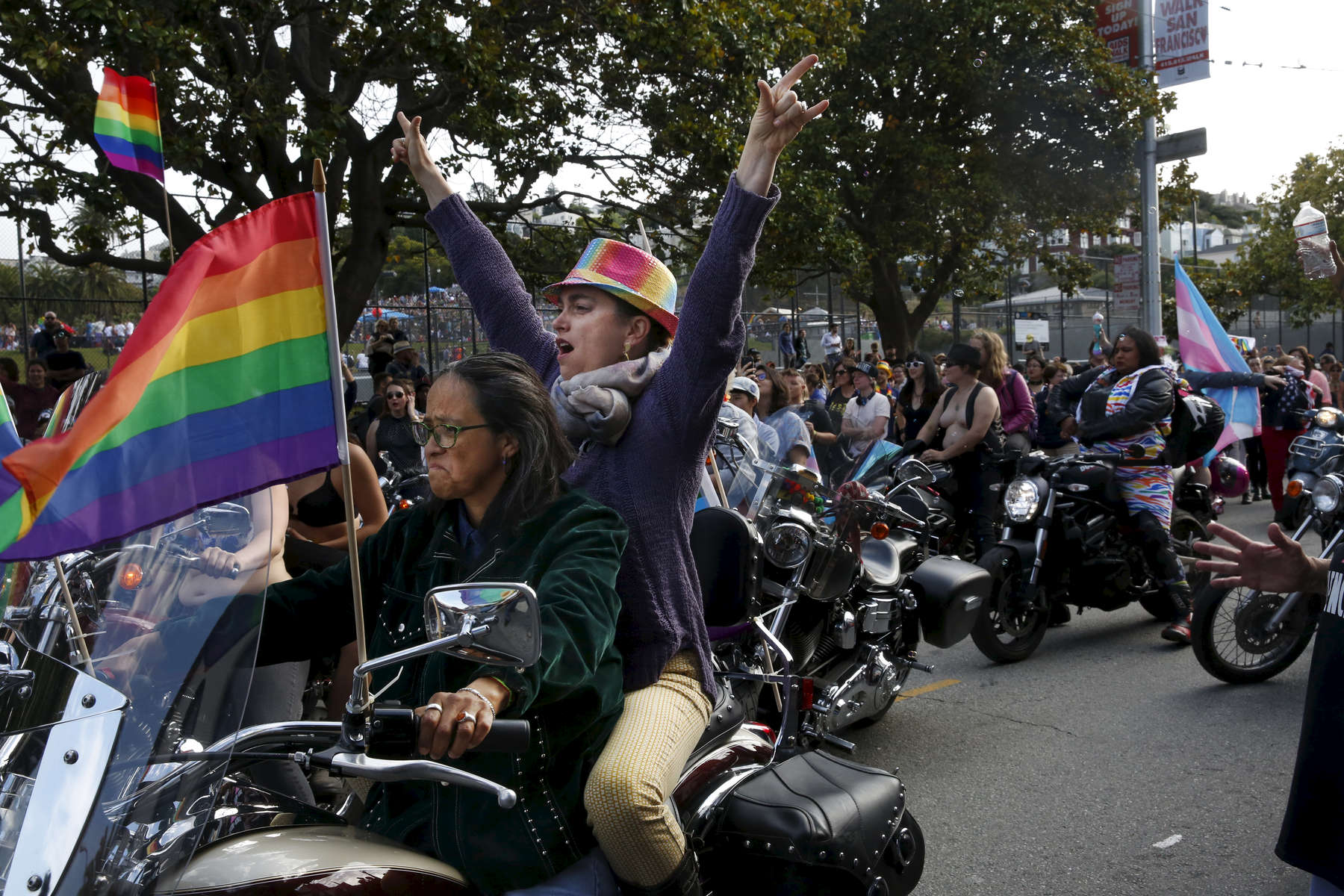 Chagua Camacho, left, revs her engine as Tracy Burt cheers right before they start the parade with the rest of the Dykes on Bikes during the annual Dyke March that started at Mission Dolores park and snaked around the neighborhood up through the Castro and back June 24, 2017 in San Francisco, Calif. 