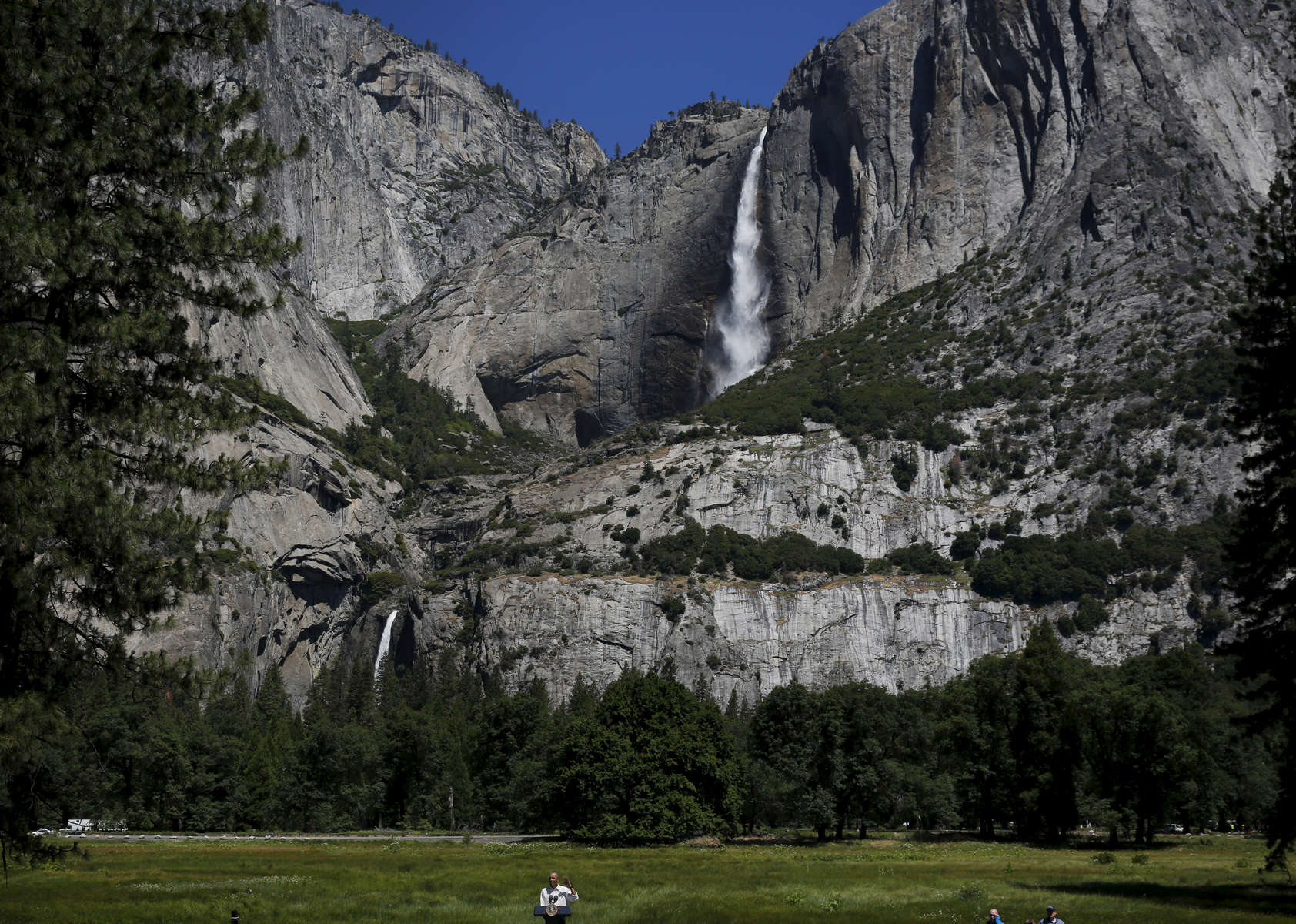 President Barack Obama speaks in Cook's Meadow at Yosemite National Park about the national park system and a program called {quote}every kid in a park{quote} June 18, 2016 in Yosemite Valley, Calif. The program will give fourth graders a pass that will allow them and their families free access to all national parks.