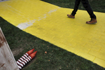 A man walks across a short brick pathway that was later painted yellow and a small Wizard of Oz house was also later added on the Facebook campus Nov. 12, 2014 in Menlo Park, Calif. 