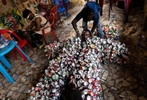 Eddy Ekete puts on his costume before a performance in the streets of Kinshasa.