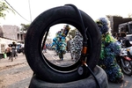 {quote}Ndaku ya La vie est belle{quote} members walk in the streets of Kinshasa during a performance.