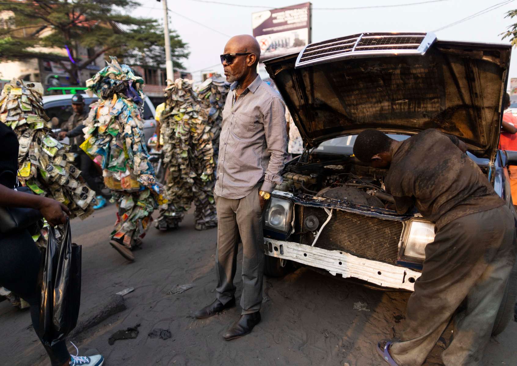 {quote}Ndaku ya La vie est belle{quote} members walk in the streets of Kinshasa during a performance.