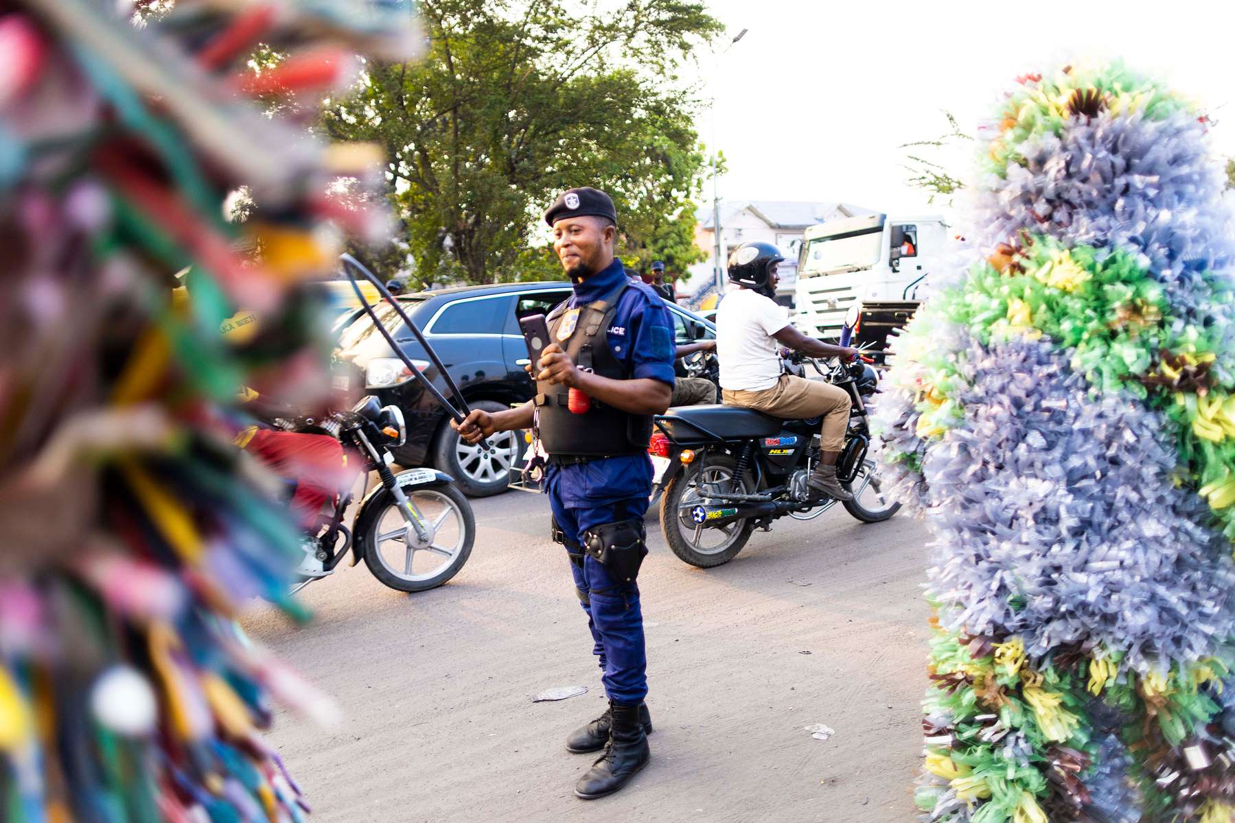 {quote}Ndaku ya La vie est belle{quote} members walk in the streets of Kinshasa during a performance.