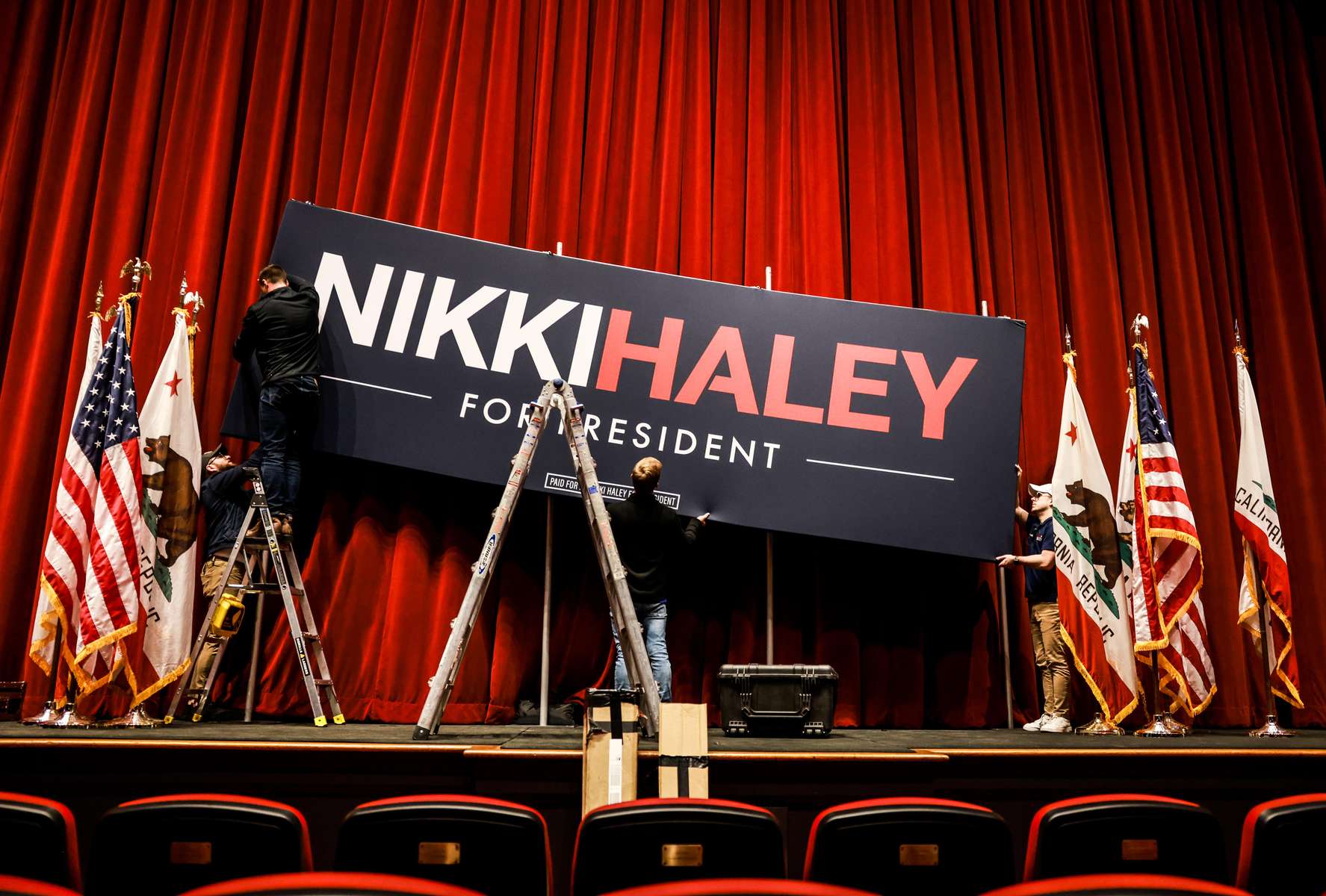 A campaign sign is removed after US Republican presidential hopeful and former UN Ambassador Nikki Haley spoke at an event in Los Angeles.