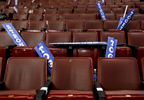Signs saying {quote}stronger together{quote} lay on empty seats at the end of the DNC.