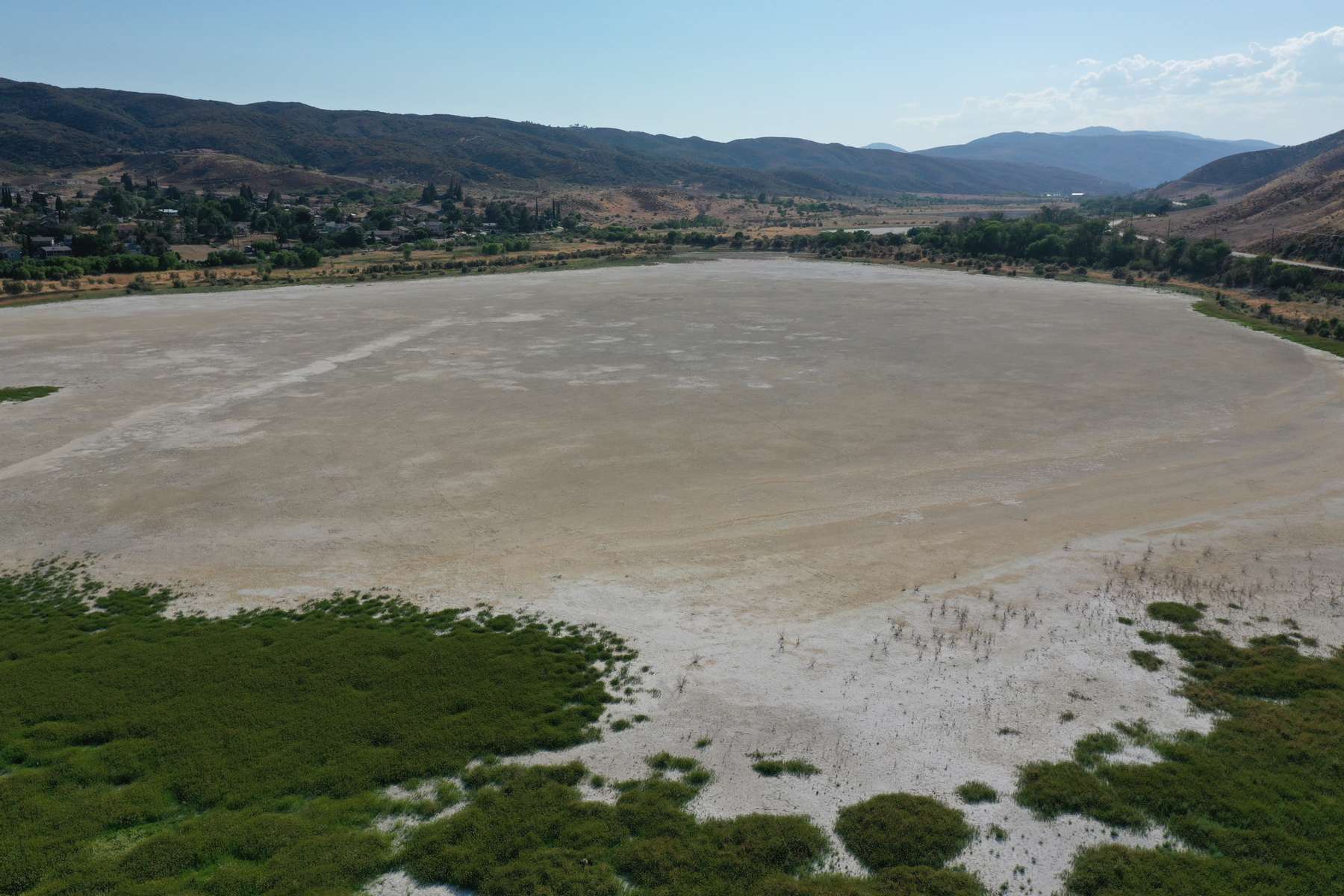 An aerial view shows Elizabeth Lake, that has been dried up for several years, as the region experiences extreme heat and drought conditions, in Elizabeth Lake, an unincorporated community in Los Angeles County, California, U.S., June 18, 2021. Picture taken with a drone June 18, 2021. 