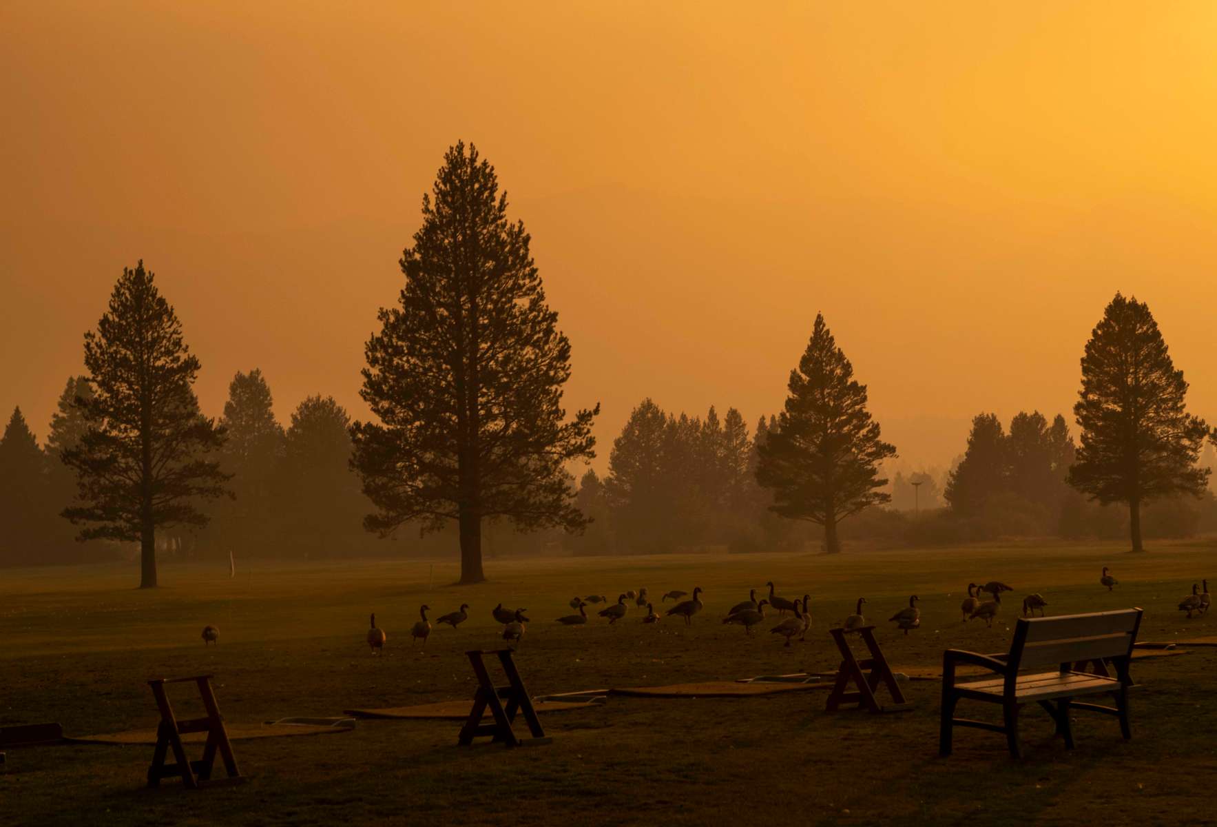 Smoke is seen over the Lake Tahoe golf course, as the Caldor fire rages near by on August 29, 2021, in South Lake Tahoe, California. The Caldor Fire has burned over 165,000 acres, destroyed over 660 structures and is currently 14 percent contained. 