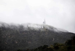 The Hollywood sign is seen through dust snow during a rare cold winter storm in the Los Angeles area, in Los Angeles, California, U.S., February 24, 2023. 