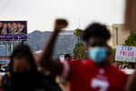 Protesters march peacefully during a march over the death of George Floyd, an unarmed black man, who died after a police officer kneeled on his neck for several minutes, in the Hollywood neighborhood on June 1, 2020, in Los Angeles, California.