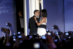 THE END OF THE ANONYMITYPresident Barack Obama and his wife Michelle open the Youth Ball, one of the inauguration balls, in  Washington, DC, January 20, 2009. They are surrounded by cameras, while a Secret Service agent watches in the shadow.