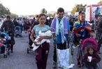 A mother breastfeeding her two months old baby Gabriella, is part of a migrant caravan heading to the northern border, in Santo Domingo Zanatepec, Mexico November 10, 2021.Thousands of migrants, including many children, fleeing violence and poverty, are taking the roads through Mexico, trying to reach the US border and hoping the new Biden administration will make it easier for them to enter the United States.