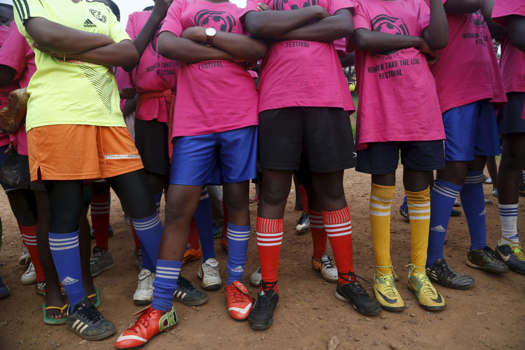 Girls listen to their coaches during the {quote}Women take the Lead{quote} festival, a soccer event for Congolese refugee youth in Kampala, Uganda.