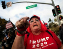 Supporters watch the plane Air Force One landing before a Make America Great Again rally of US President Donald Trump on October 28, 2020 in Bullhead, Arizona.