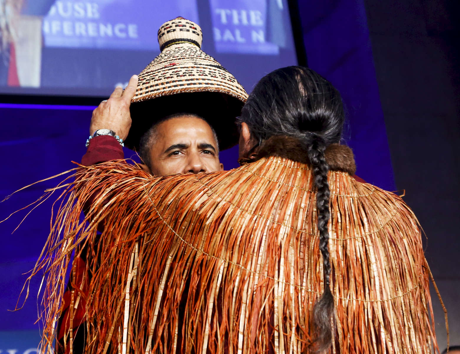President Barack Obama receives a traditional blanket and hat during a blanketing ceremony at the 2016 White House Tribal Nations Conference.