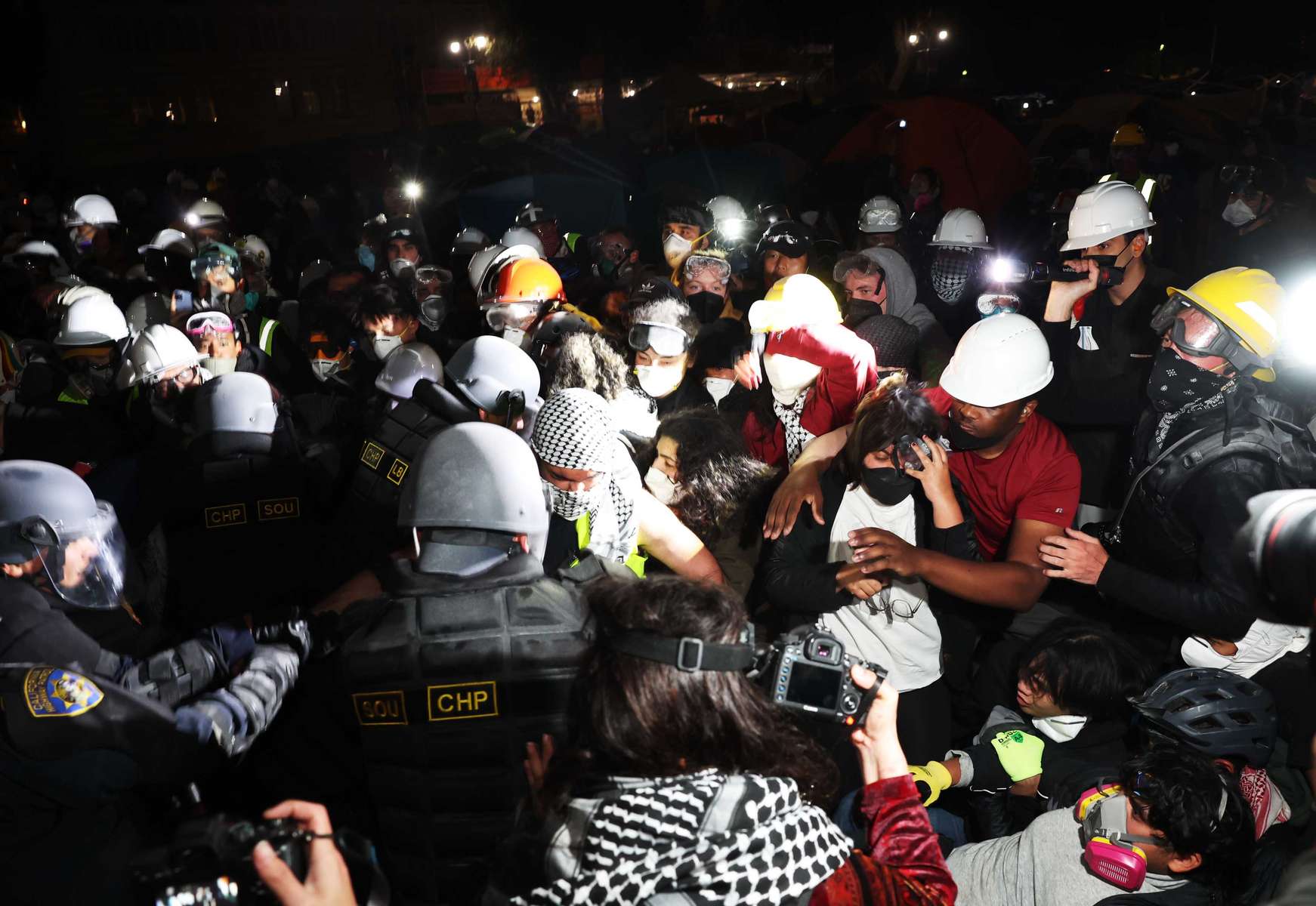 Members of law enforcement enter a Pro-Palestinian encampment at UCLA on May 2, 2024 in Los Angeles, California.