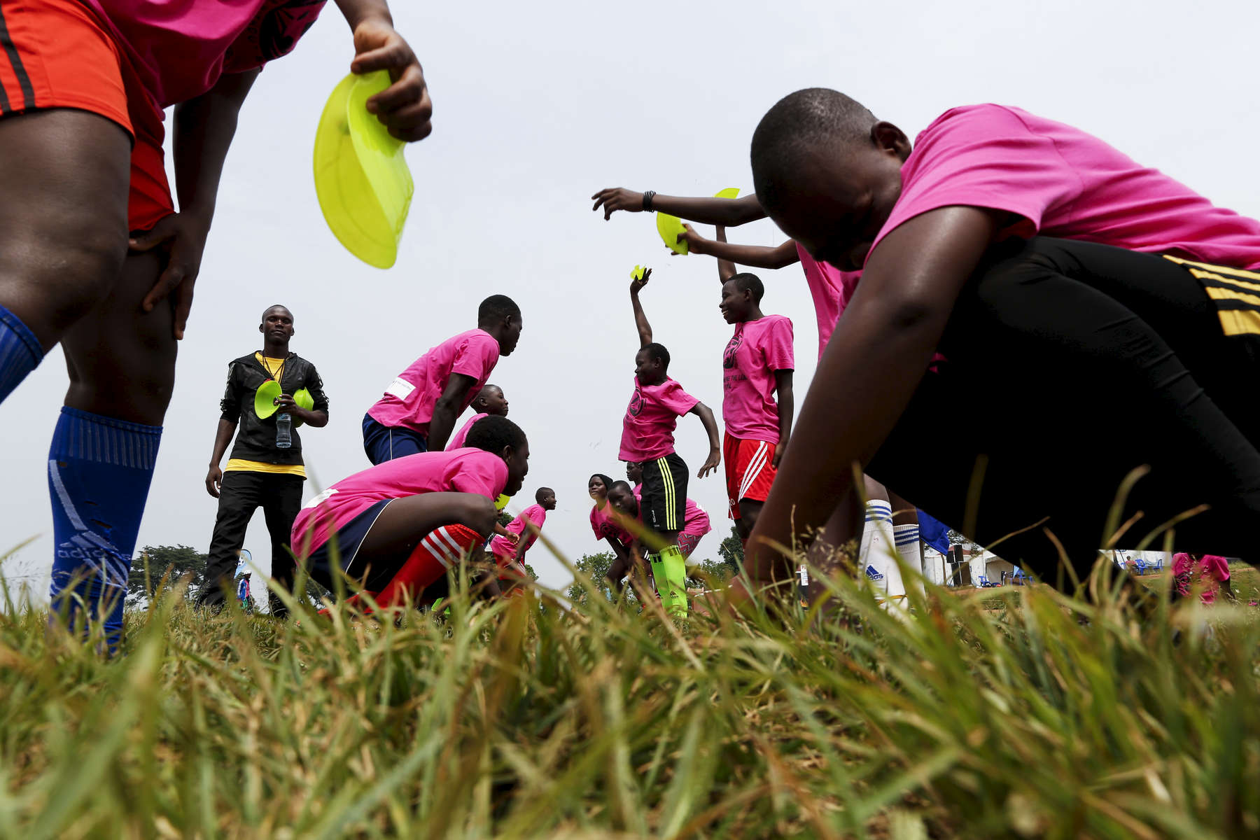 Participants play a game at the {quote}Women take the Lead{quote} festival, a soccer event for Congolese refugee youth in Kampala, Uganda.