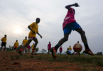 Participants play a soccer game at the {quote}Women take the Lead{quote} festival, a soccer event for Congolese refugee youth in Kampala, Uganda.