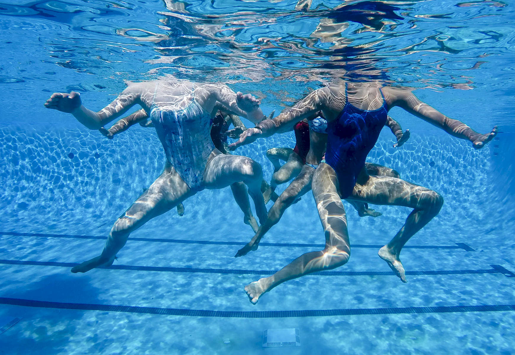 The US junior synchronized swimming team works on its routine.