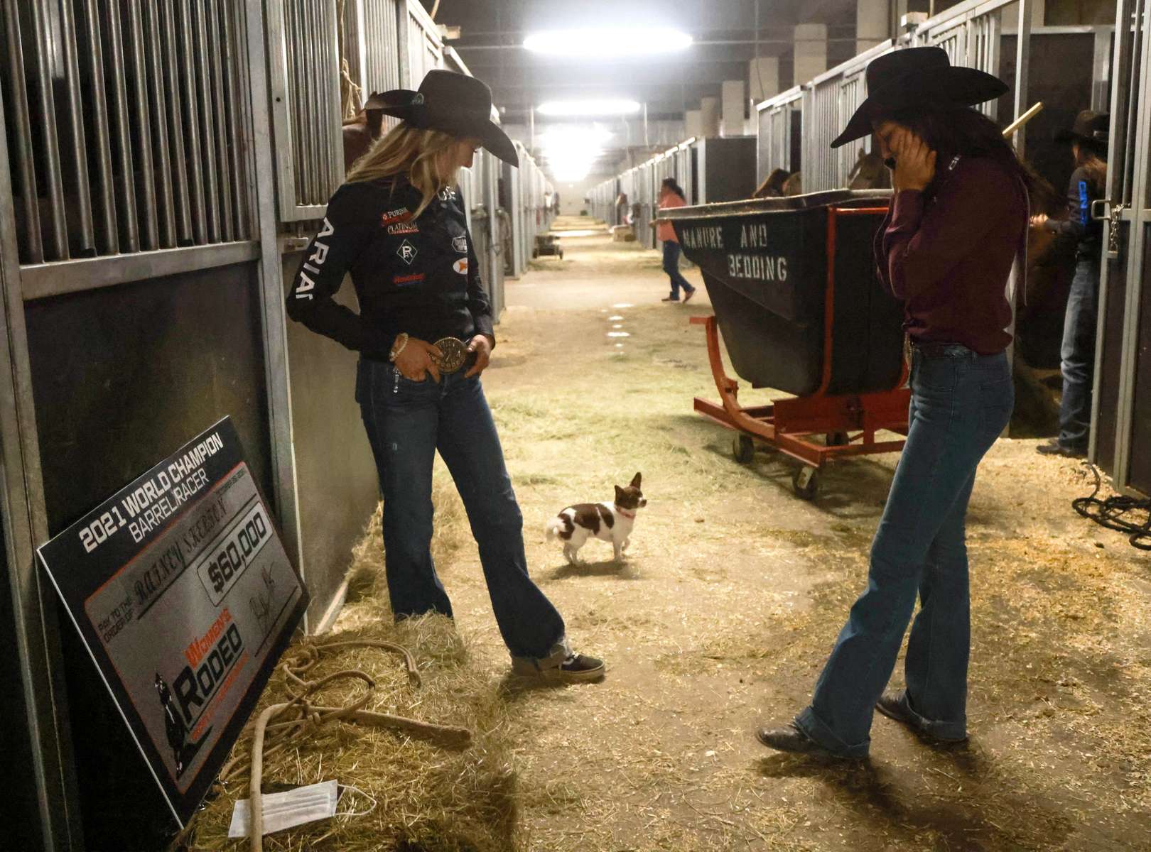 Rainey Skelton,(r) speaks on the phone after winning the Barrel Racing Main Event of the Women's Rodeo World Championship at the South Point Arena, in Las Vegas, Nevada, U.S., October 29, 2021.  