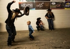 Jackie Crawford who participated in the Breakaway semi-finals speaks with other participants while her two kids are playing with them at the end of the Women's Rodeo World Championship at the South Point Arena, in Las Vegas, Nevada, U.S., October 29, 2021.  Picture taken on October 29, 2021. 