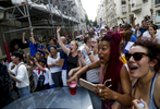Supporters react when France strikes its first goal during the World Cup Soccer final on July 15, 2018, in Paris, France.On the historical Soccer World Cup final between France and Croatia, fans were invited to watch the game on giant screens set up in the Champs de Mars, in front of the Eiffel Tower in Paris. But this Fan Zone was full long before the start of the game, leaving thousand of supporters scrambling to find a place to watch the game close by. The nearby and usually quiet coffees and restaurants were quickly over flooded. But for the next two and a half hours, it did not matter to watch the game from the middle of the streets. Very few cars were circulating, because almost everyone in France was watching, or trying to watch the game. 