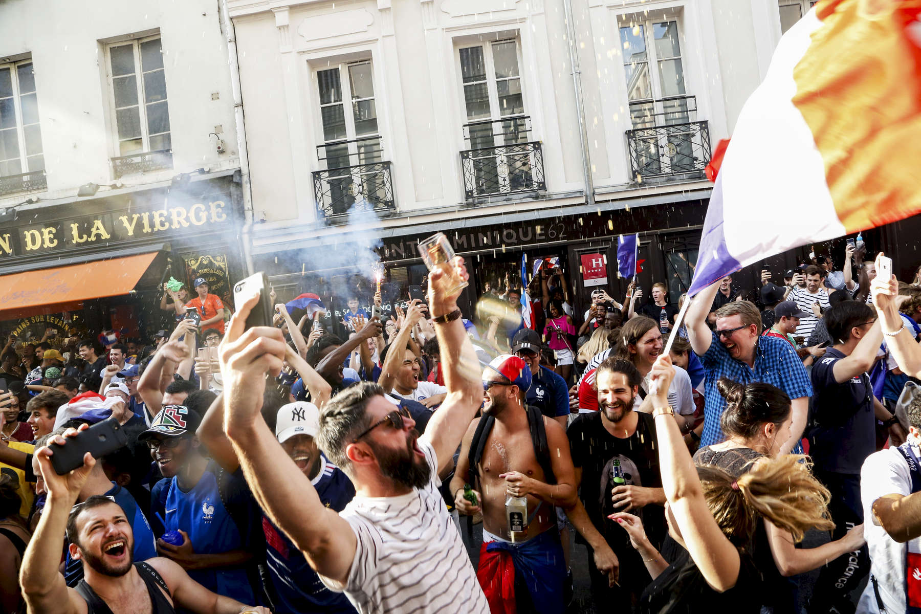 Supporters celebrate in the streets after France just won the 2018 World Cup, on July 15, 2018, in Paris France.On the historical Soccer World Cup final between France and Croatia, fans were invited to watch the game on giant screens set up in the Champs de Mars, in front of the Eiffel Tower in Paris. But this Fan Zone was full long before the start of the game, leaving thousand of supporters scrambling to find a place to watch the game close by. The nearby and usually quiet coffees and restaurants were quickly over flooded. But for the next two and a half hours, it did not matter to watch the game from the middle of the streets. Very few cars were circulating, because almost everyone in France was watching, or trying to watch the game. 