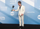 Sam Rockwell flips his award for outstanding performance by a male actor in a television movie or miniseries for {quote}Fosse/Verdon{quote} in the press room at the 26th annual Screen Actors Guild Awards at the Shrine Auditorium & Expo Hall on Sunday, Jan. 19, 2020, in Los Angeles. (Photo by Jordan Strauss/Invision/AP)