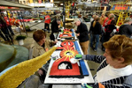 Volunteers apply final touches to the Dole Packaged Foods {quote}Rhythm of Paradise{quote} Rose Parade float during Decorating Week at Fiesta Parade Floats on Saturday, Dec. 29, 2018 in Irwindale, Calif. (Jordan Strauss/AP Images for Dole Packaged Foods)