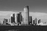 This is a view from the Staten Island Ferry, on the Hudson River.  Jersey City is the second-most-populous city in the U.S. state of New Jersey, after Newark.  Part of the New York metropolitan area, Jersey City is bounded on the east by the Hudson River and Upper New York Bay and on the west by the Hackensack River and Newark Bay.  30 Hudson Street, also known as Goldman Sachs Tower, is a 238 m (781 ft), 42-story building in Jersey City, New Jersey. It is the tallest building in New Jersey.  Completed in 2004, the tower was designed by César Pelli.  The tower sits on the waterfront overlooking the Hudson River and Lower Manhattan