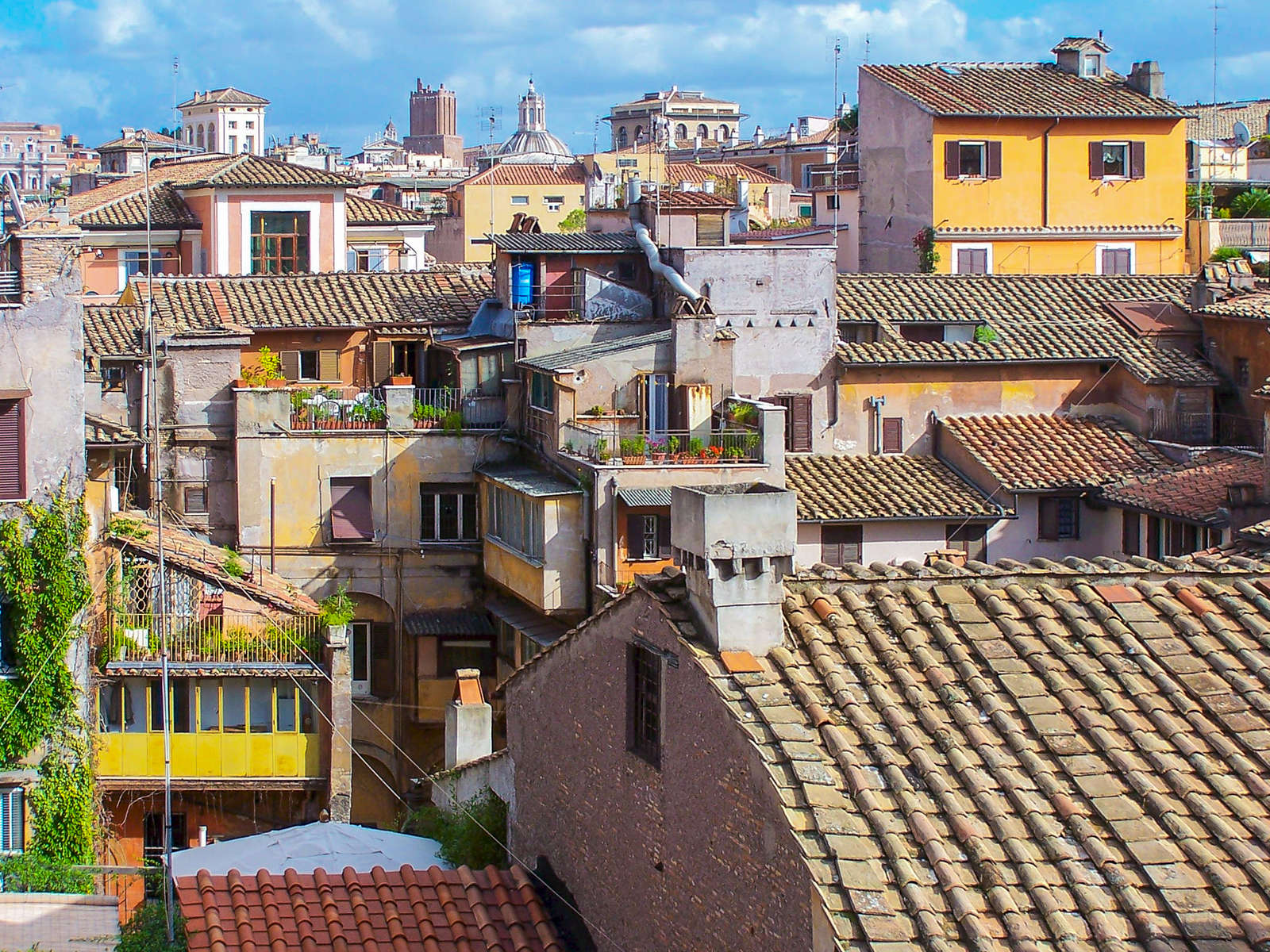 Rome, Italy. Roof gardens are most often found in urban environments. The environmental and aesthetic benefits to cities are the prime motivation.  A roof garden is well suited to roof spaces that incorporate recreation, entertaining, and provide additional outdoor living space for the building's residents. It may include planters, plants, dining and lounging furniture, outdoor structures such as pergolas and sheds, and automated irrigation and lighting systems.