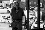 Homeless man squatting at bus stop in Hartwell, a Cincinnati neighborhood.Minorities are among the populations most vulnerable to falling into homelessness.   This disparity suggests that policies and programs to prevent and end homelessness must explicitly consider race as a factor in order to be of maximum effectiveness.