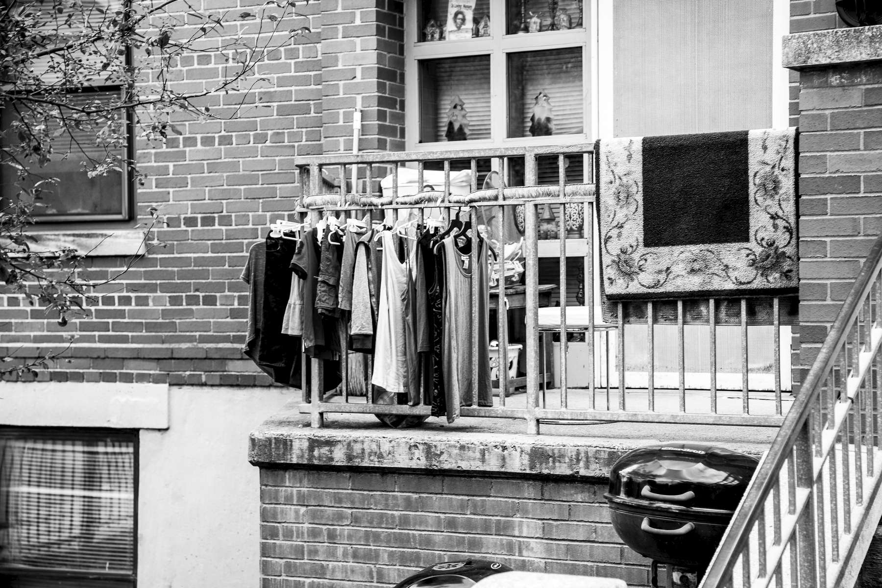 Clothes Drying Outside an apartment at Liberty Apartments, a low income, subsidized CMHA, 130-unit property located in Cincinnati's West End.Numerous factors affect where people live, however, one factor that still exists is wage discrimination.  Wage stagnation and income inequality contribute to the gap between what people earn and the cost of their housing. Out of Reach 2016 highlights the affordability gap between the cost of rental housing and the wages of millions of renters who do not earn enough to afford a decent and safe home without significant sacrifice. Low income renters face the greatest challenge. Higher wages and a greater supply of affordable rental housing are necessary. If we make further gains in minimum wage legislation and expand funding for the national Housing Trust Fund, we can address the affordability gap.  