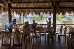 Quaint cafe on the beach near the ancient Mayan ruins at Tulum, Mexico, with a gorgeous view of the Caribbean Sea.